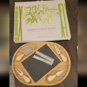 Bamboo cheese board with utensils
